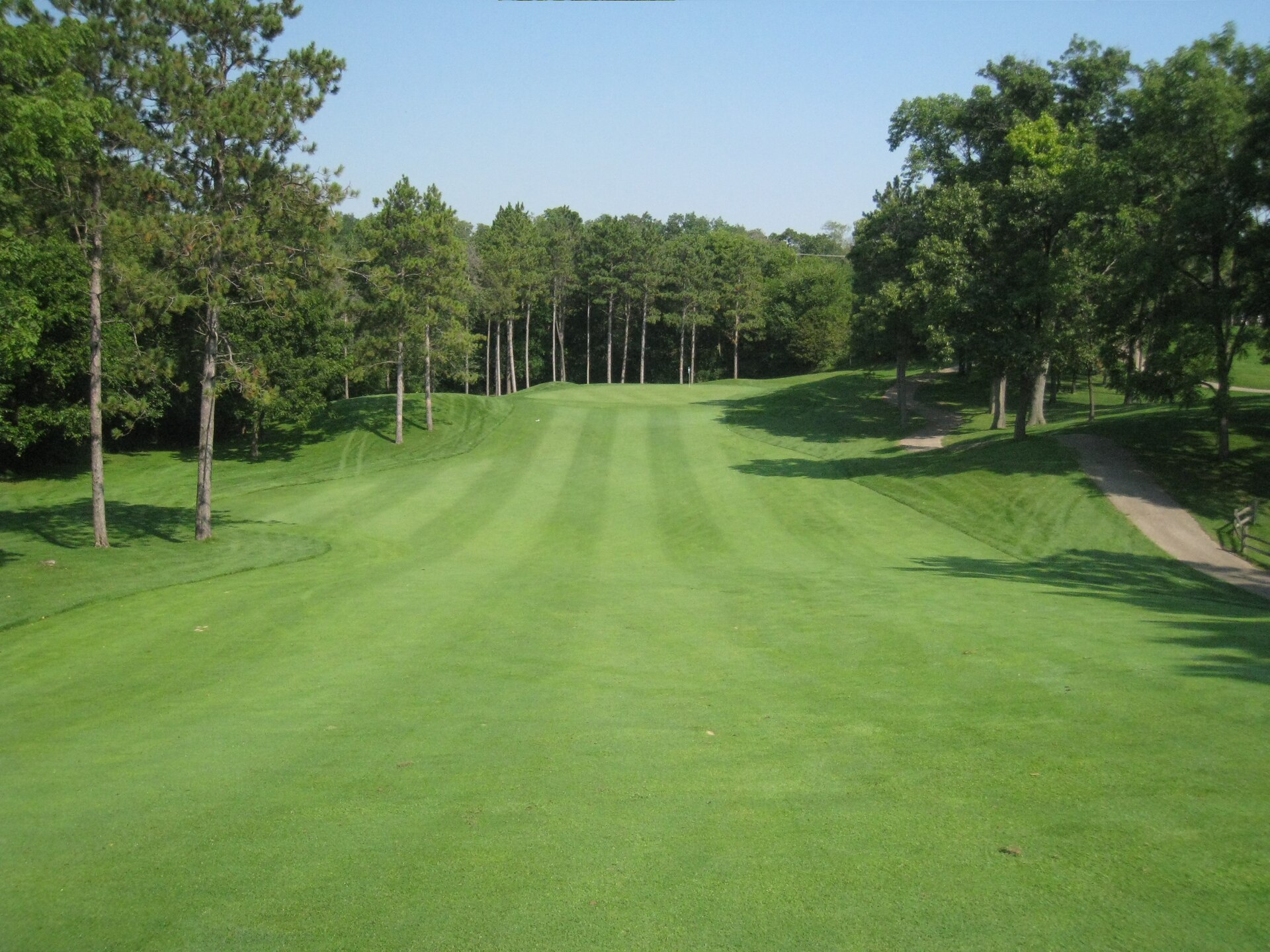 Open golf fairway leading toward the green